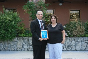 Terry Watkins (l), Southeastern regional director, Webster Data Communications, presents a scholarship to Stephanie Wood of Summerville High School.